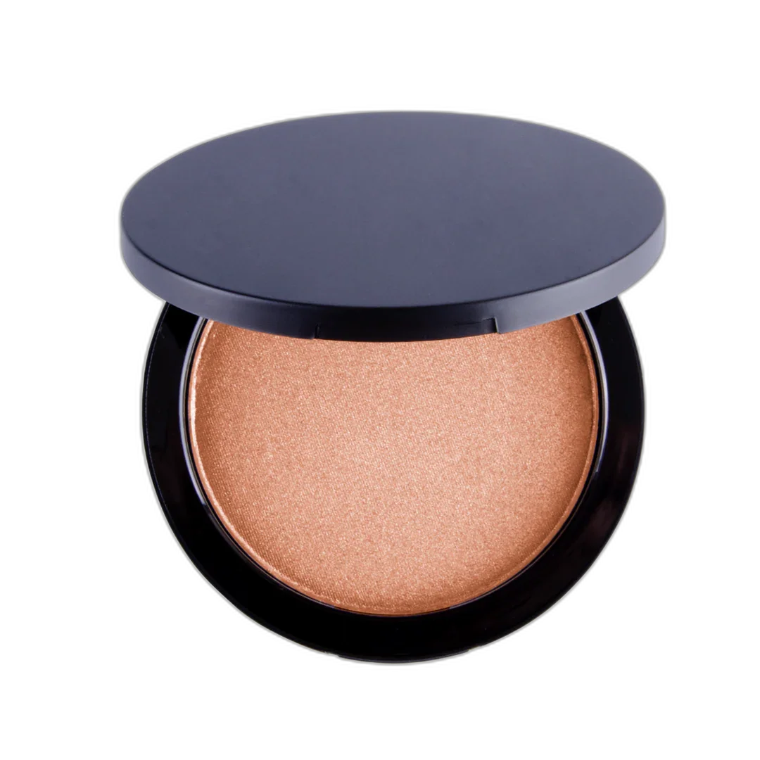 Open compact powder makeup with shimmering beige bronzer on black background