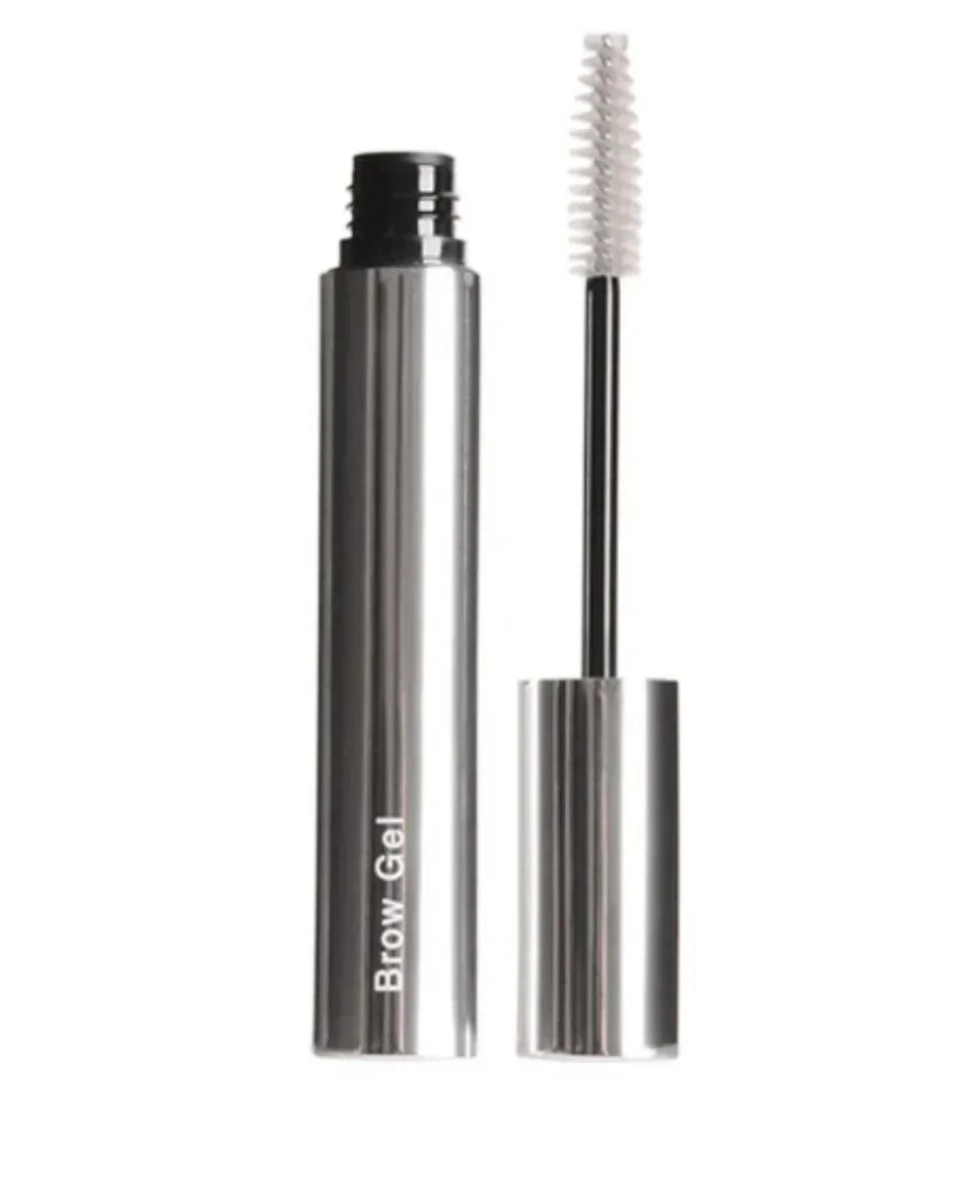 Silver metallic tube of clear brow gel with spoolie brush applicator on white background