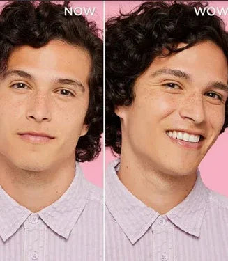 Side-by-side images of a man with dark curly hair wearing a light purple shirt, showing a neutral expression labeled 'NOW' and a smiling expression labeled 'WOW' on a pink background.