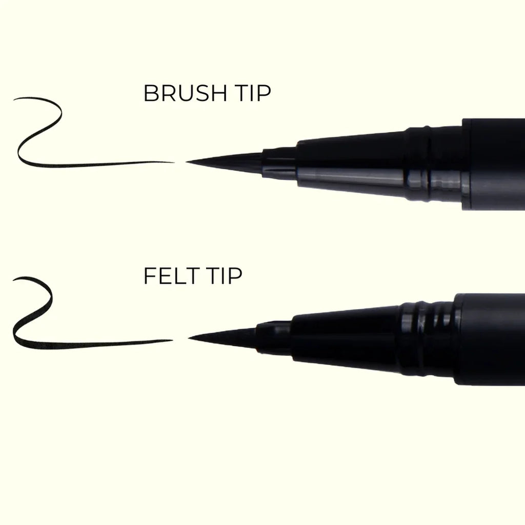 Close-up of brush tip and felt tip black markers showing each tip type and ink stroke on light background